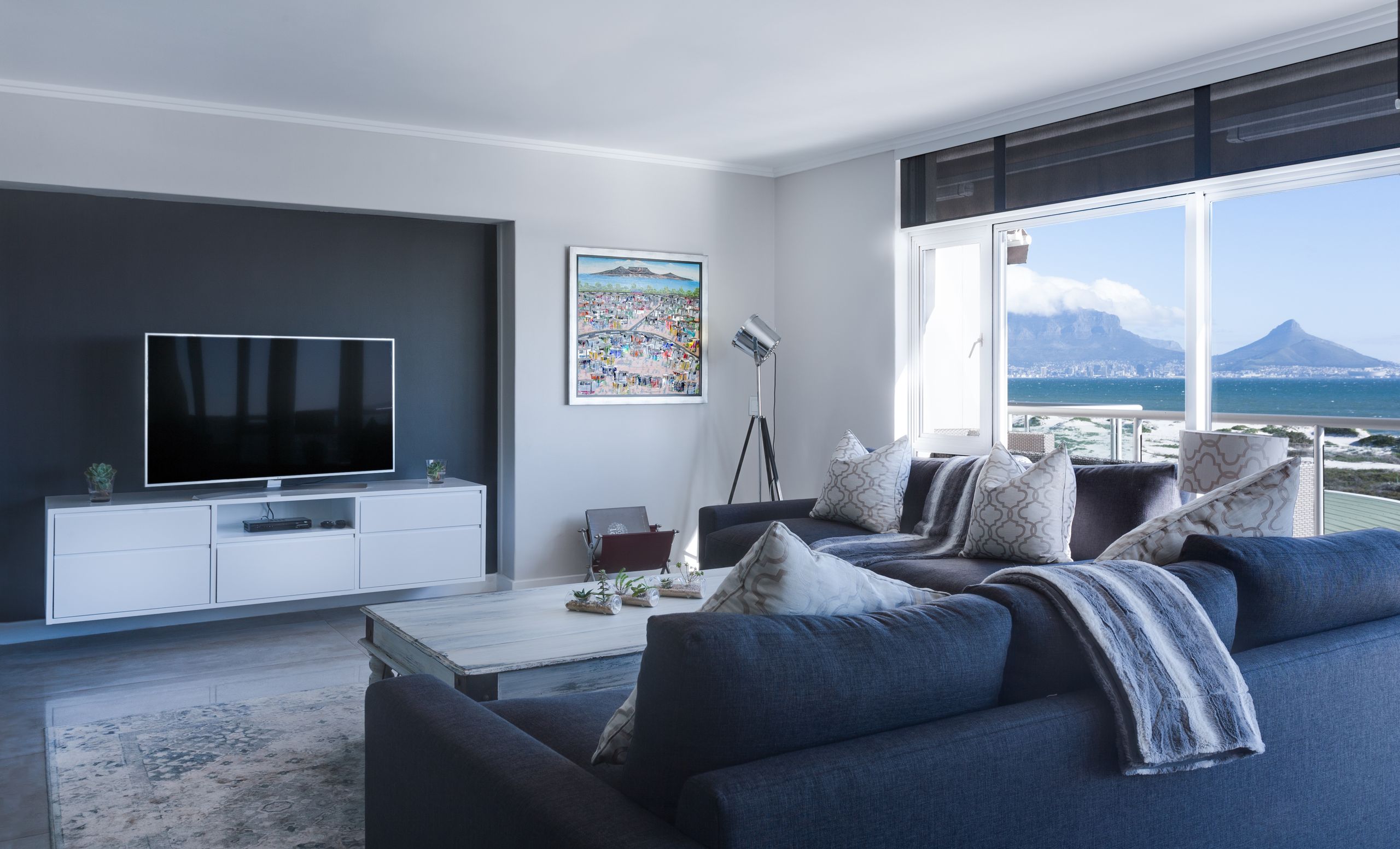 A Cape Town living room looking across the bay to Table Mountain and Lion’s Head